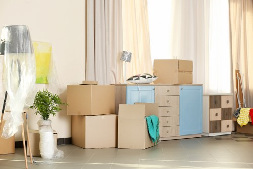 Professional same day removals team in West Kensington handling urgent home moving boxes