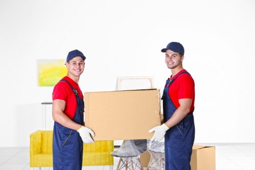 Student removals planning in West Kensington with packed boxes