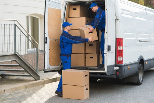 Professional team loading office furniture during Westkensington collection