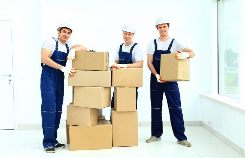 Packed boxes and wrapped household items ready for same day removals in West Kensington