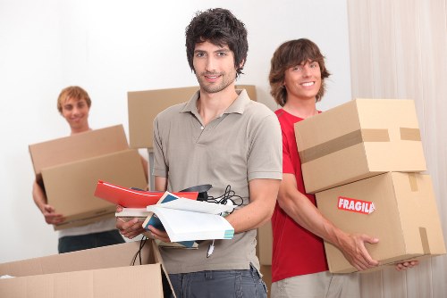 Careful loading of household items by a removal company in West Kensington