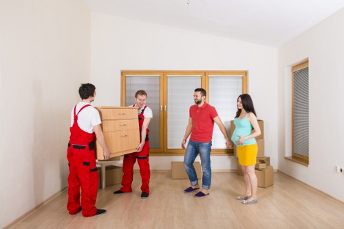 Careful loading of boxes and furniture for a student move in West Kensington