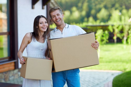 Professional movers loading furniture for a Westkensington house relocation